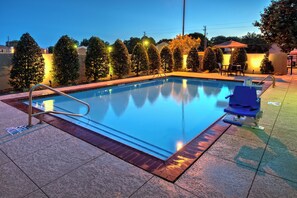 Outdoor pool, open 6:00 AM to 10:00 PM, pool umbrellas
