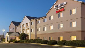 A Fairfield Inn & Suites Marriott hotel with a modern design, featuring a large parking lot and well-maintained landscaping.