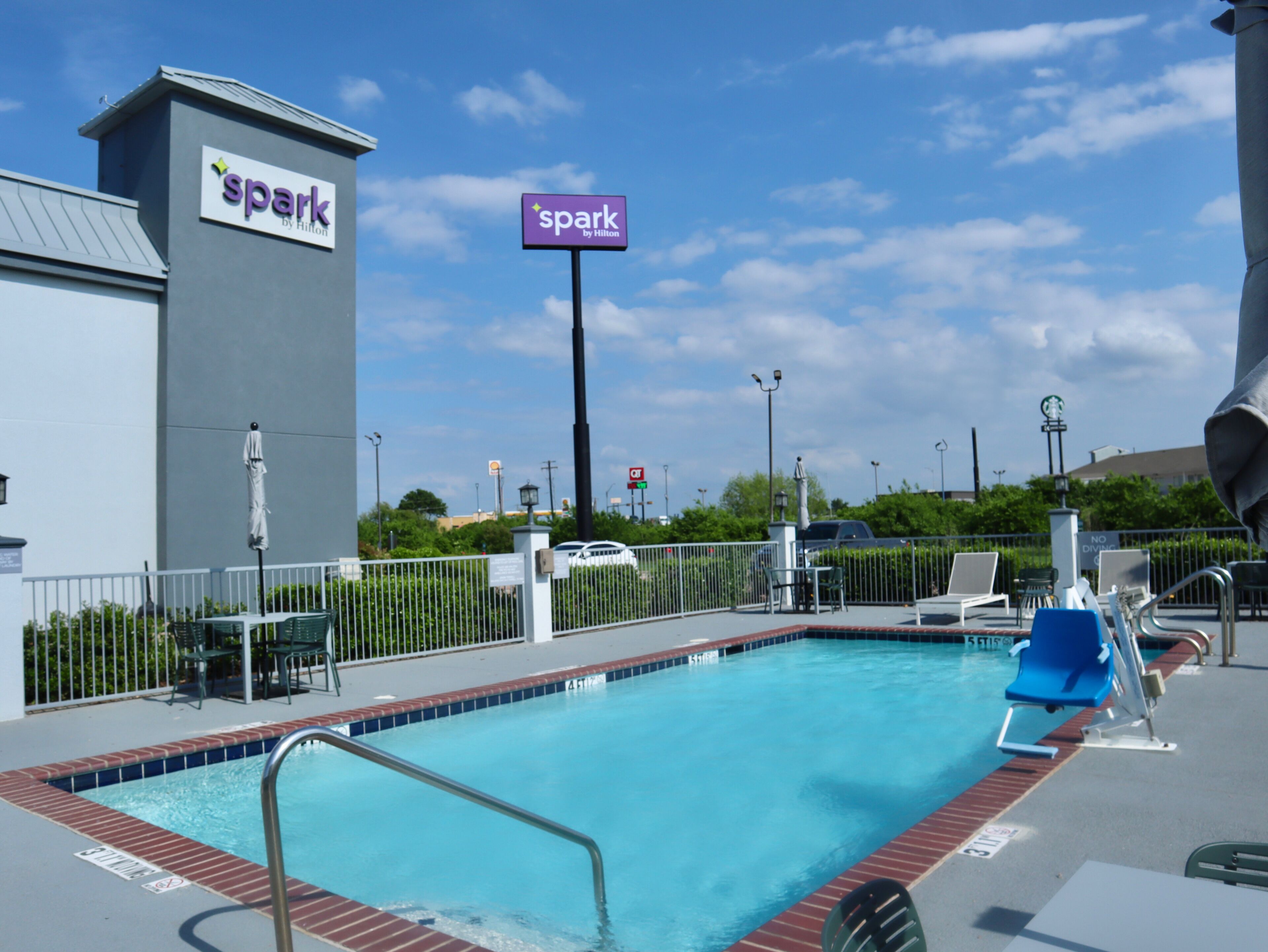 Seasonal outdoor pool, open 9:00 AM to 9:00 PM, pool umbrellas