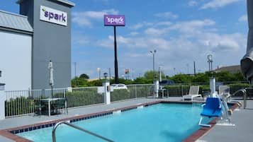 Seasonal outdoor pool, open 9:00 AM to 9:00 PM, pool umbrellas