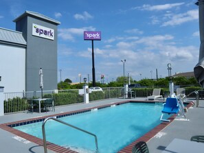 Seasonal outdoor pool, open 9:00 AM to 9:00 PM, pool umbrellas