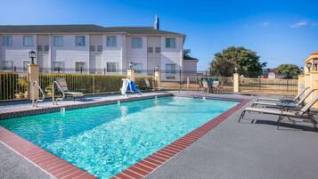 Seasonal outdoor pool, open 9:00 AM to 9:00 PM, pool umbrellas