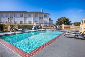 Seasonal outdoor pool, open 9:00 AM to 9:00 PM, pool umbrellas