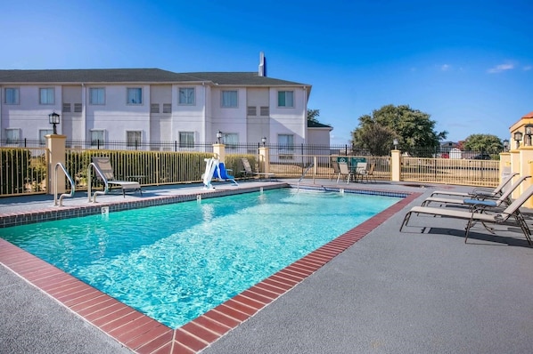 Seasonal outdoor pool, open 9:00 AM to 9:00 PM, pool umbrellas