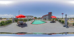 Seasonal outdoor pool, open 9:00 AM to 9:00 PM, pool umbrellas