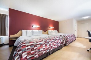 A hotel room with two beds, a desk, and a chair. - Red Roof Inn Laredo (Laredo)