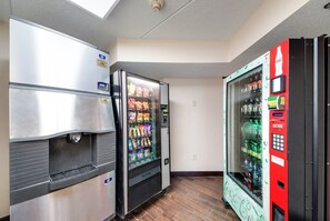 A vending area with a refrigerator, a snack vending machine, and a Coca-Cola vending machine. - Red Roof Inn Laredo (Laredo)