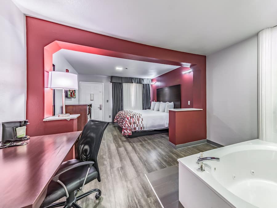 Desk, blackout curtains, free cots/infant beds, free WiFi