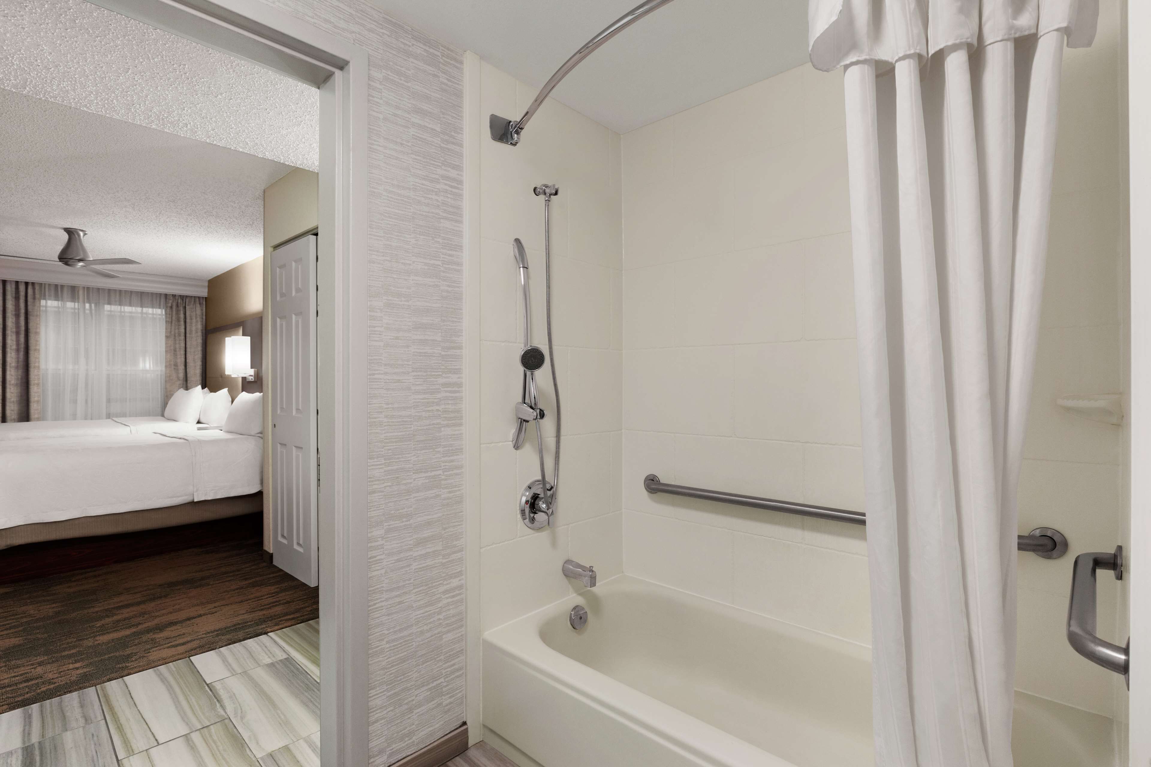 bathtub, free toiletries, hair dryer, towels