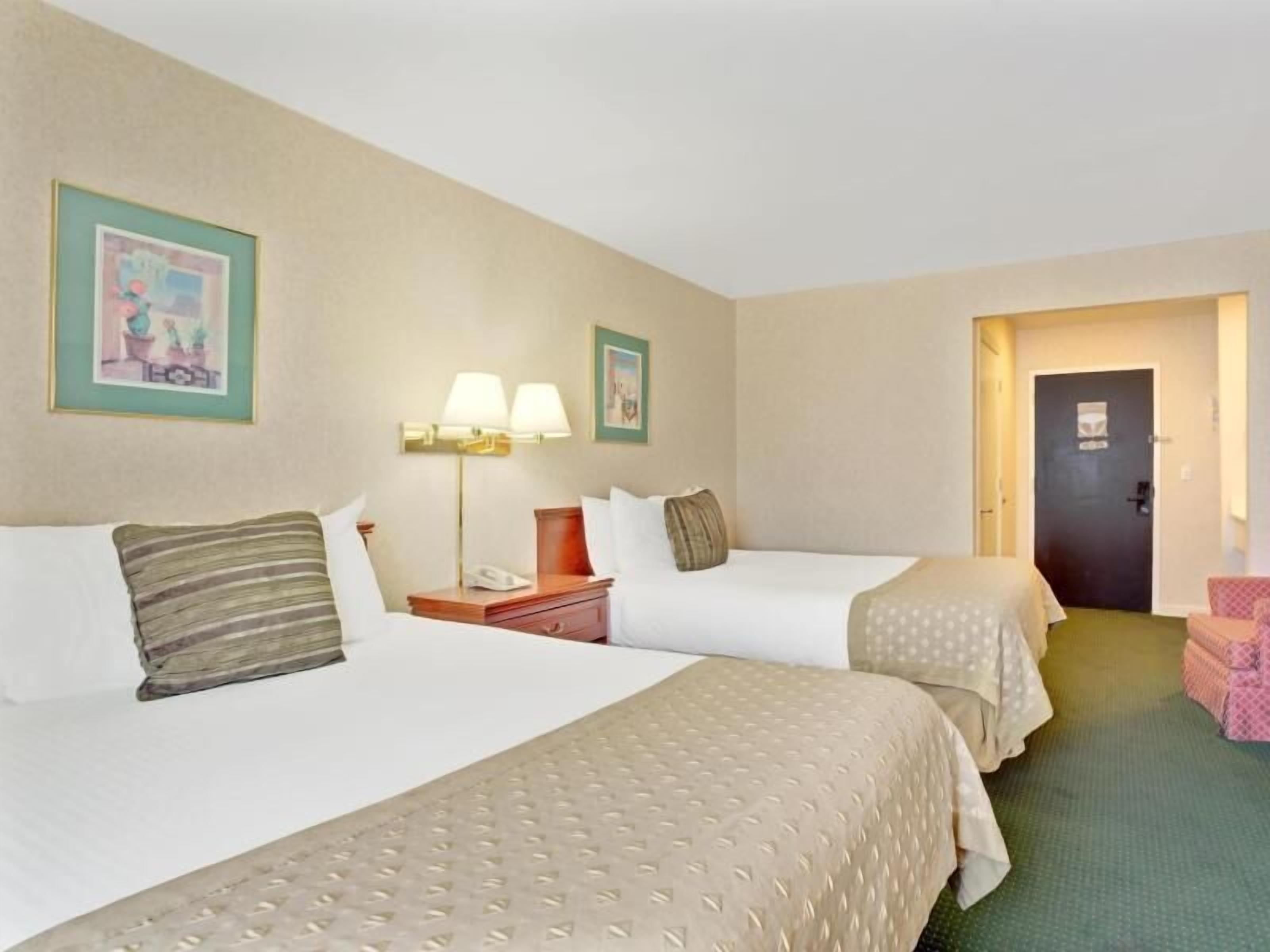 Desk, laptop workspace, blackout drapes, iron/ironing board