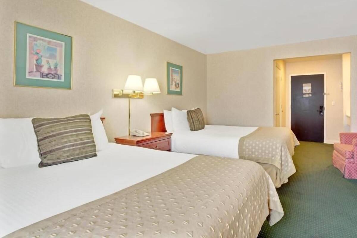 Desk, laptop workspace, blackout drapes, iron/ironing board