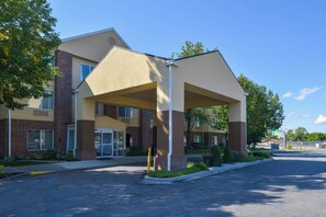 A hotel with a covered entrance, brick facade, and a clear sky. - Fairfield Inn by Marriott Salt Lake City Layton (Layton)