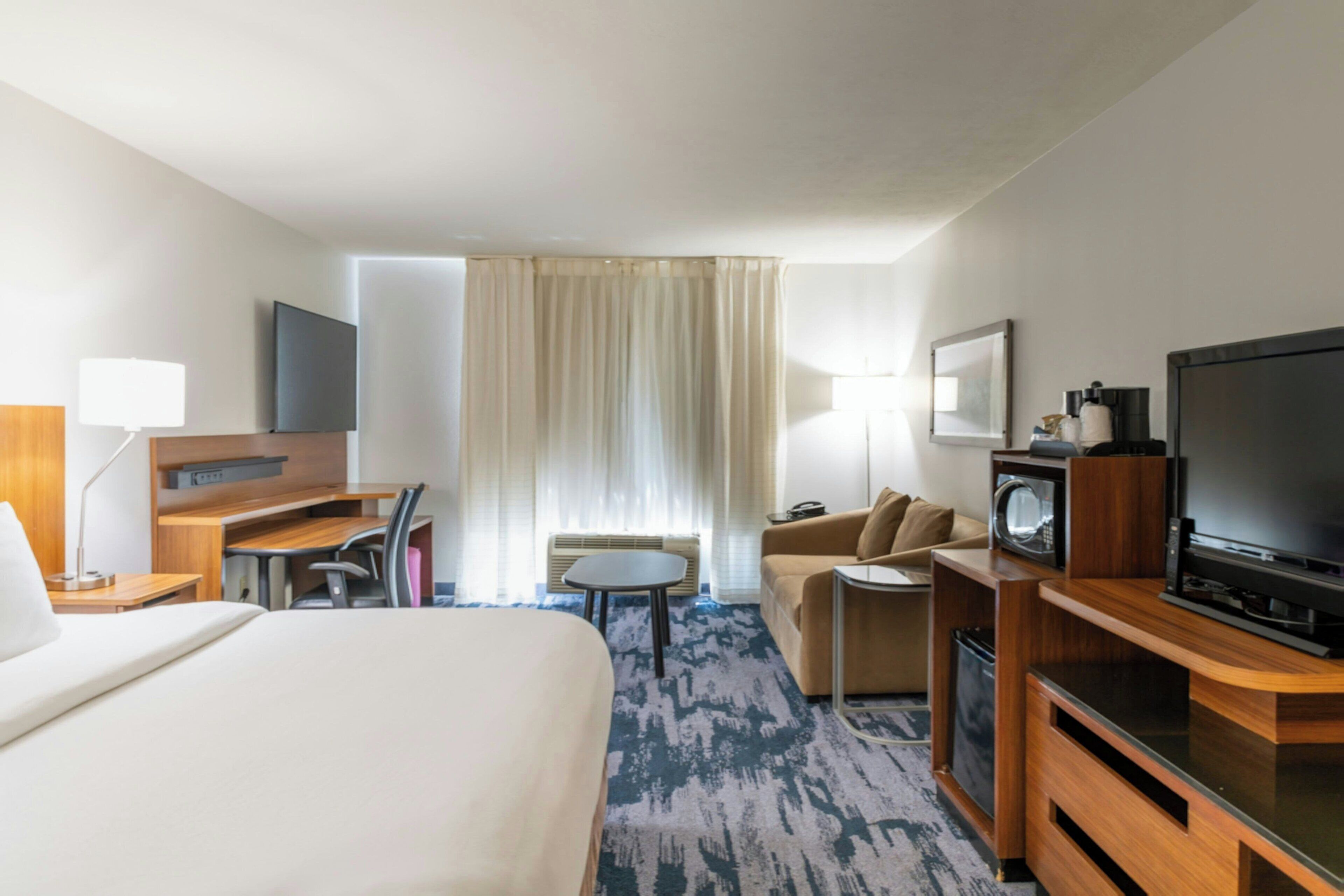 Room, 1 King Bed with Sofa bed | Laptop workspace, blackout drapes, iron/ironing board