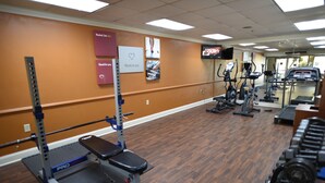 A gym with cardio equipment, weight machines, and dumbbells. - Spark by Hilton Salem East Electric Road (Salem)