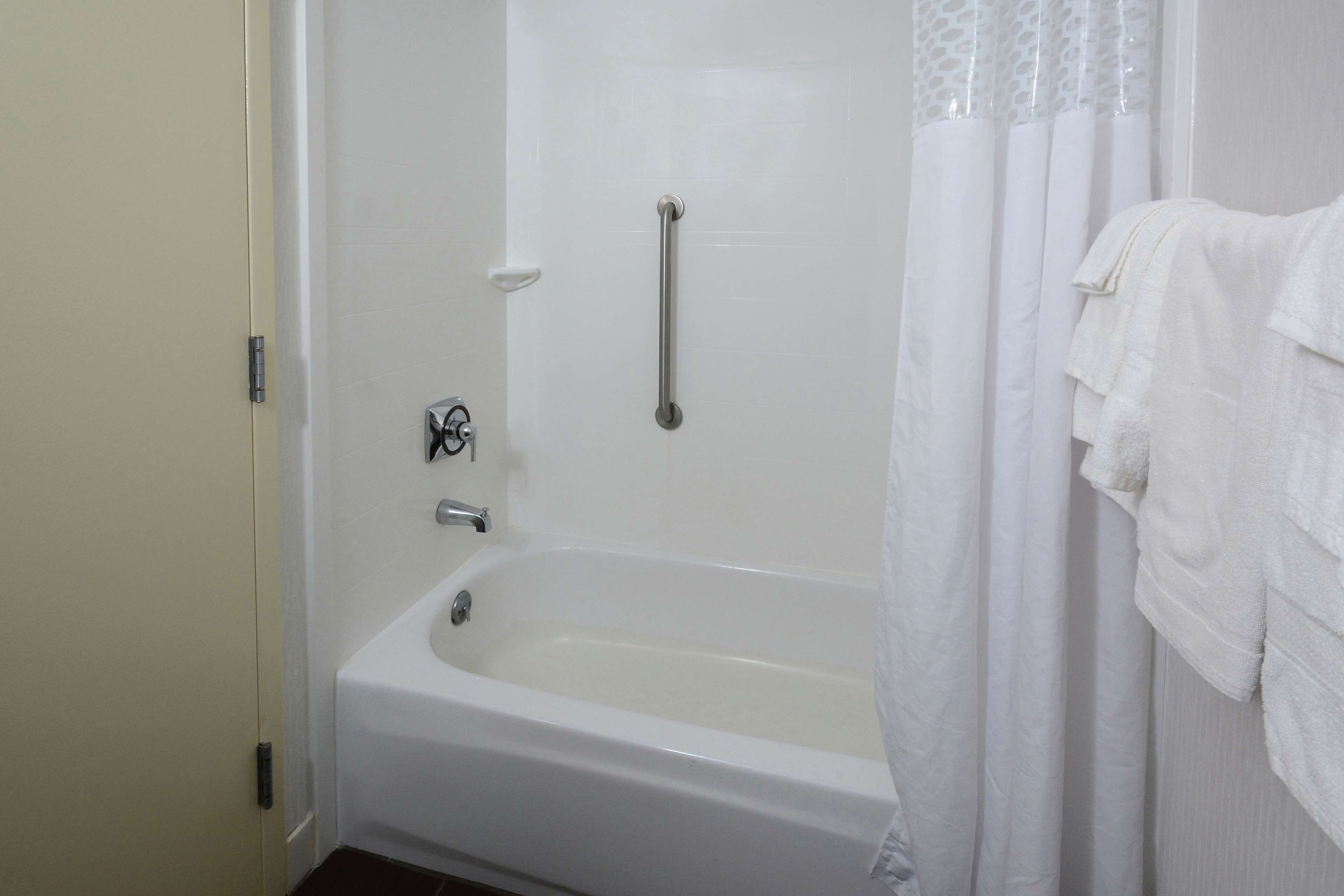 luxury suite, 1 king bed, non smoking | bathroom | combined shower/bathtub, designer toiletries, towels