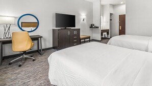 A hotel room with two beds, a desk with a chair, a TV, and a mirror. - Holiday Inn Express Wenatchee by IHG (Wenatchee)