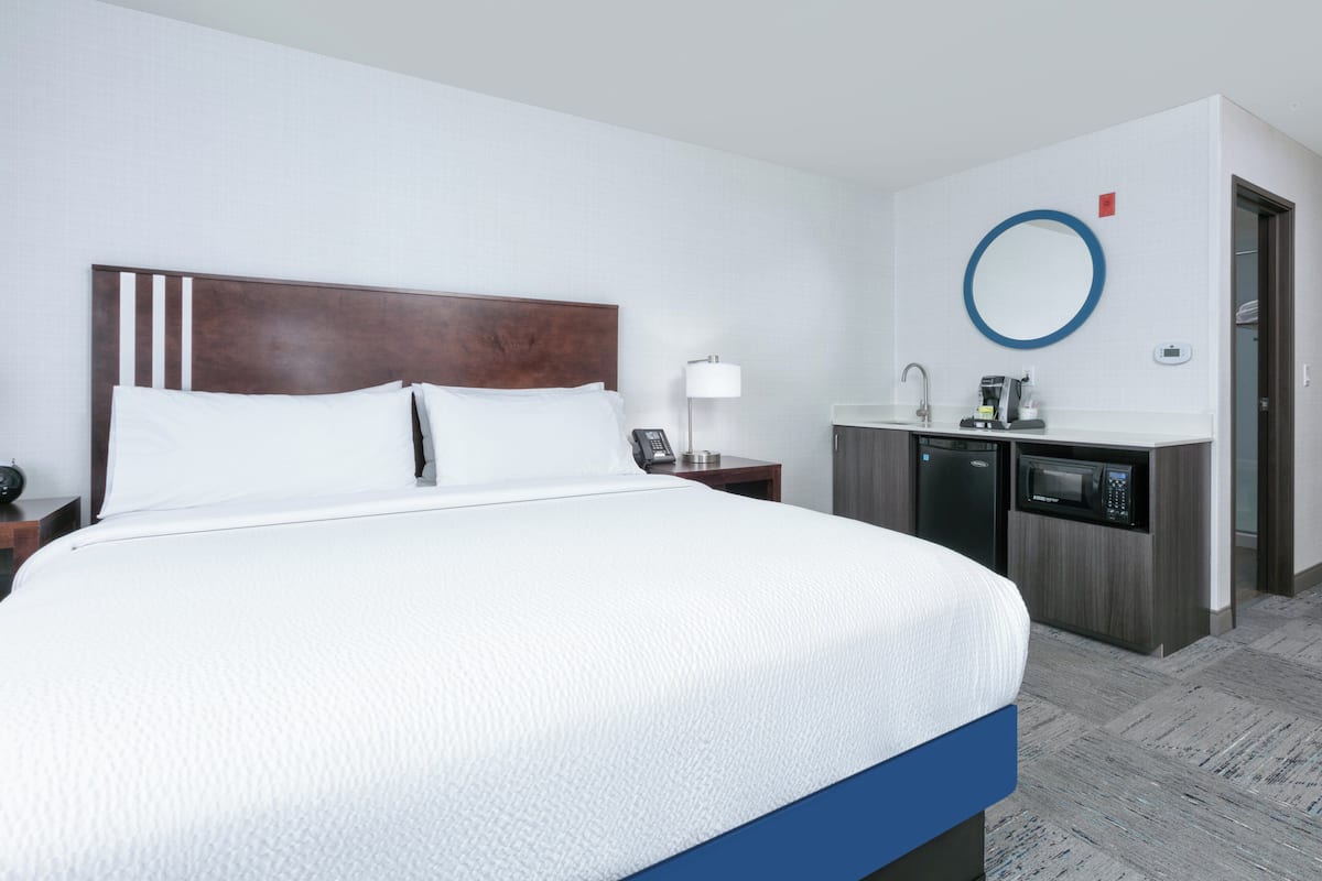 Suite, 1 King Bed | 1 bedroom, in-room safe, blackout drapes, iron/ironing board