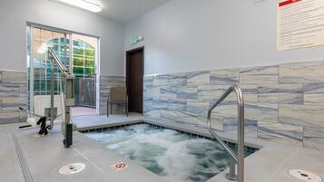 Indoor pool, open 6:00 AM to 11 PM, pool loungers