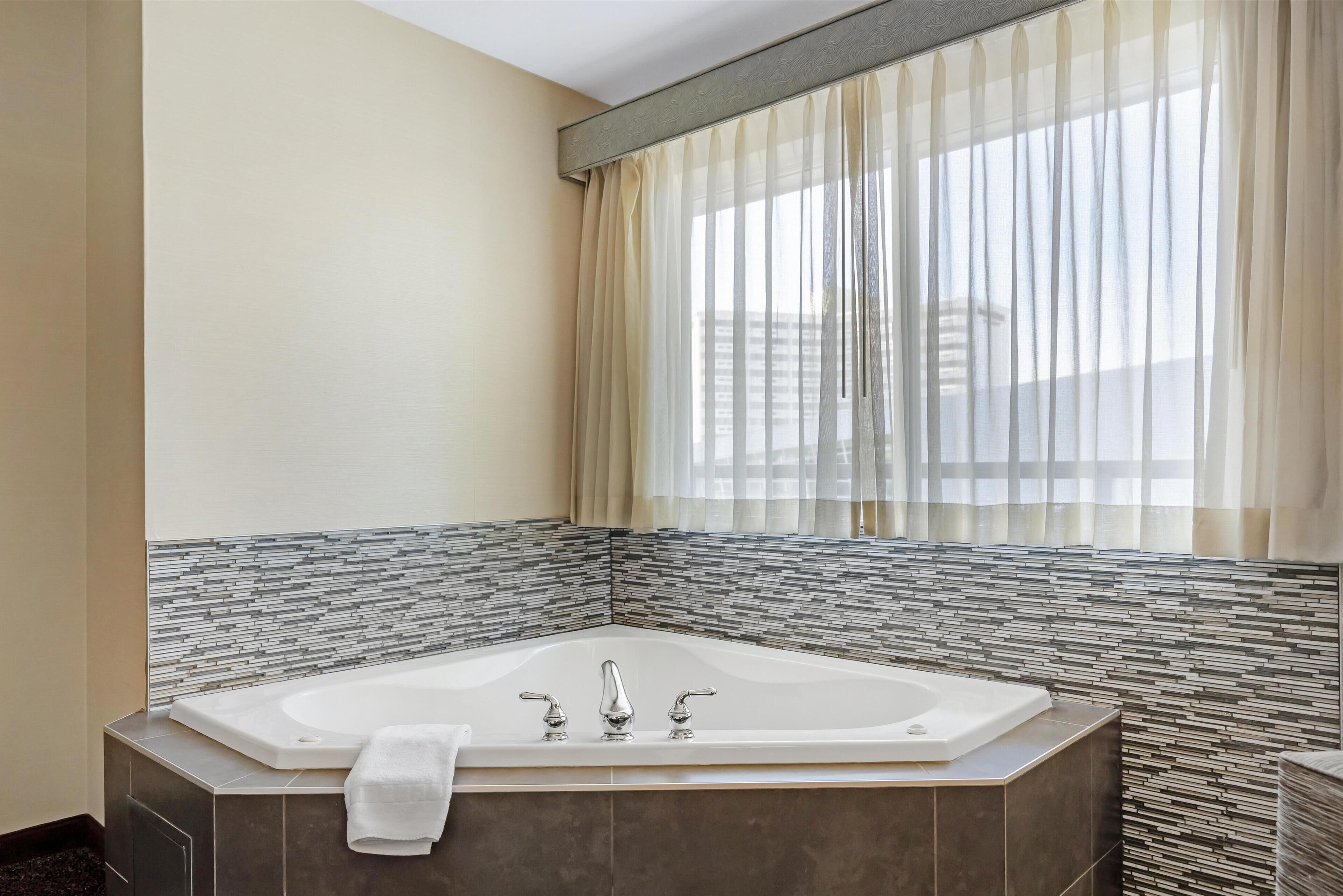 suite, 1 king bed, non smoking, jetted tub (with sofabed) | premium bedding, in-room safe, individually decorated