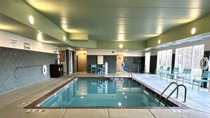 An indoor swimming pool with clear pool rules signs, lifeguard chairs, and a no diving sign. - Best Western Watertown (Watertown)