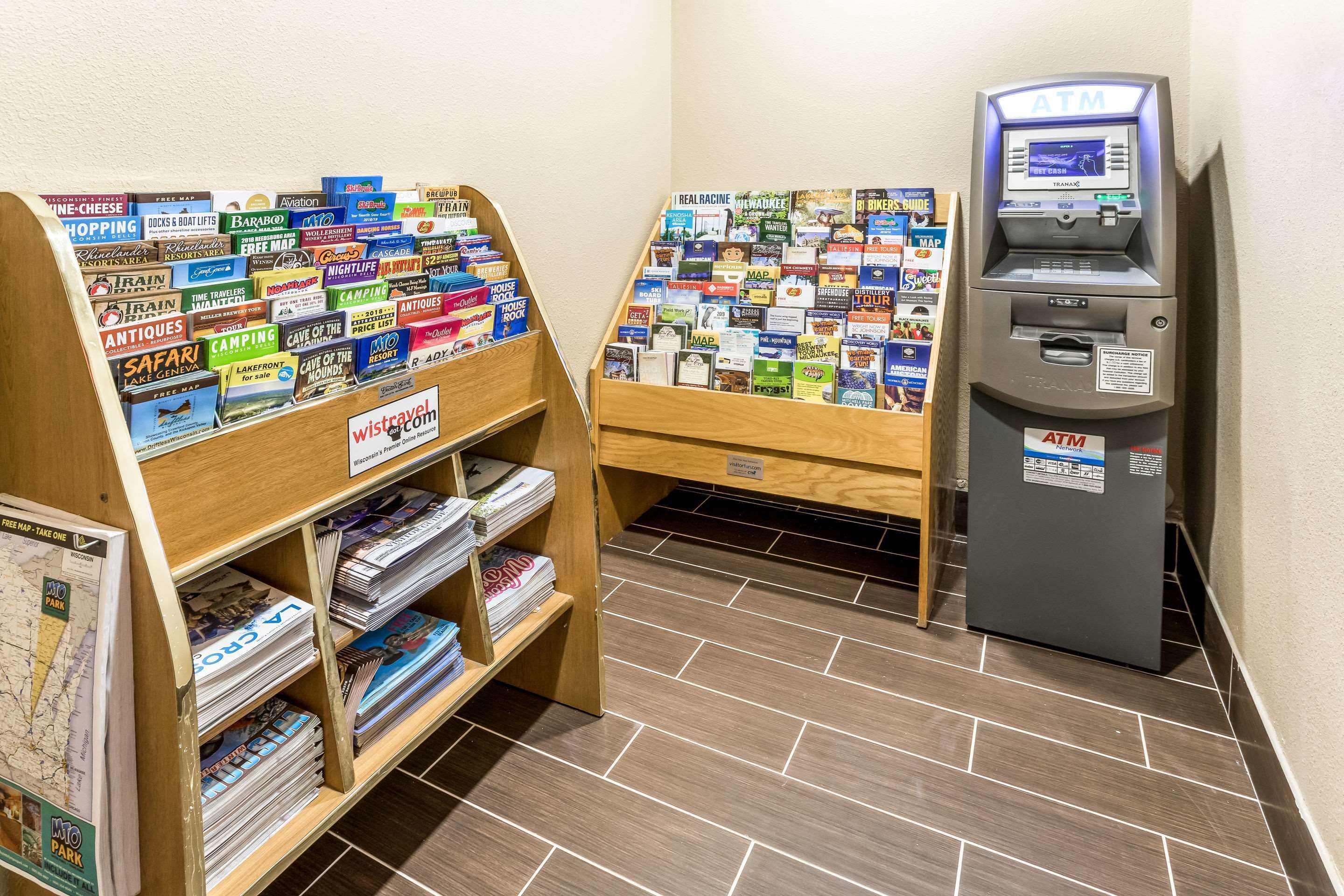A travel information kiosk with a map display and a self-service ATM.