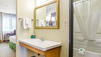 Premium bedding, desk, laptop workspace, blackout curtains
