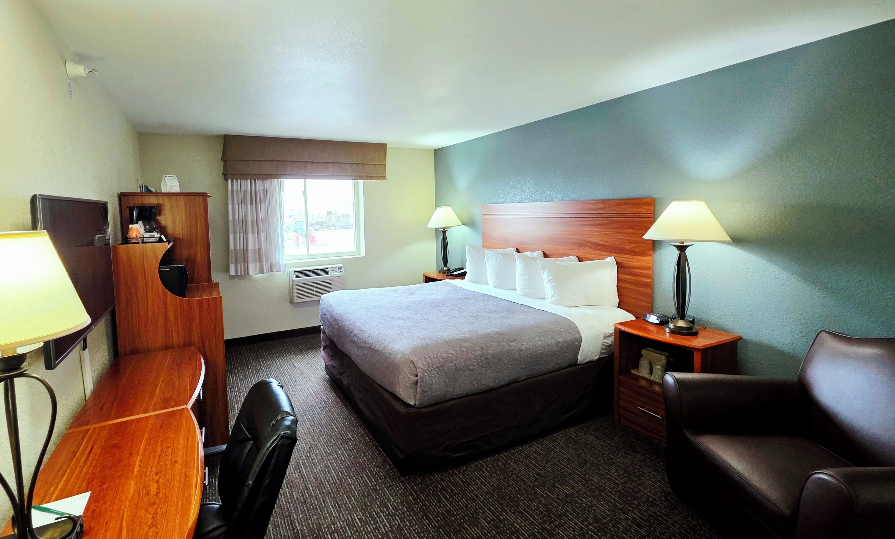 Desk, blackout drapes, iron/ironing board, free cribs/infant beds