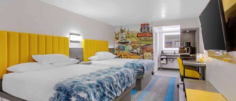 A hotel room with a bed, a desk, a chair, and a TV.