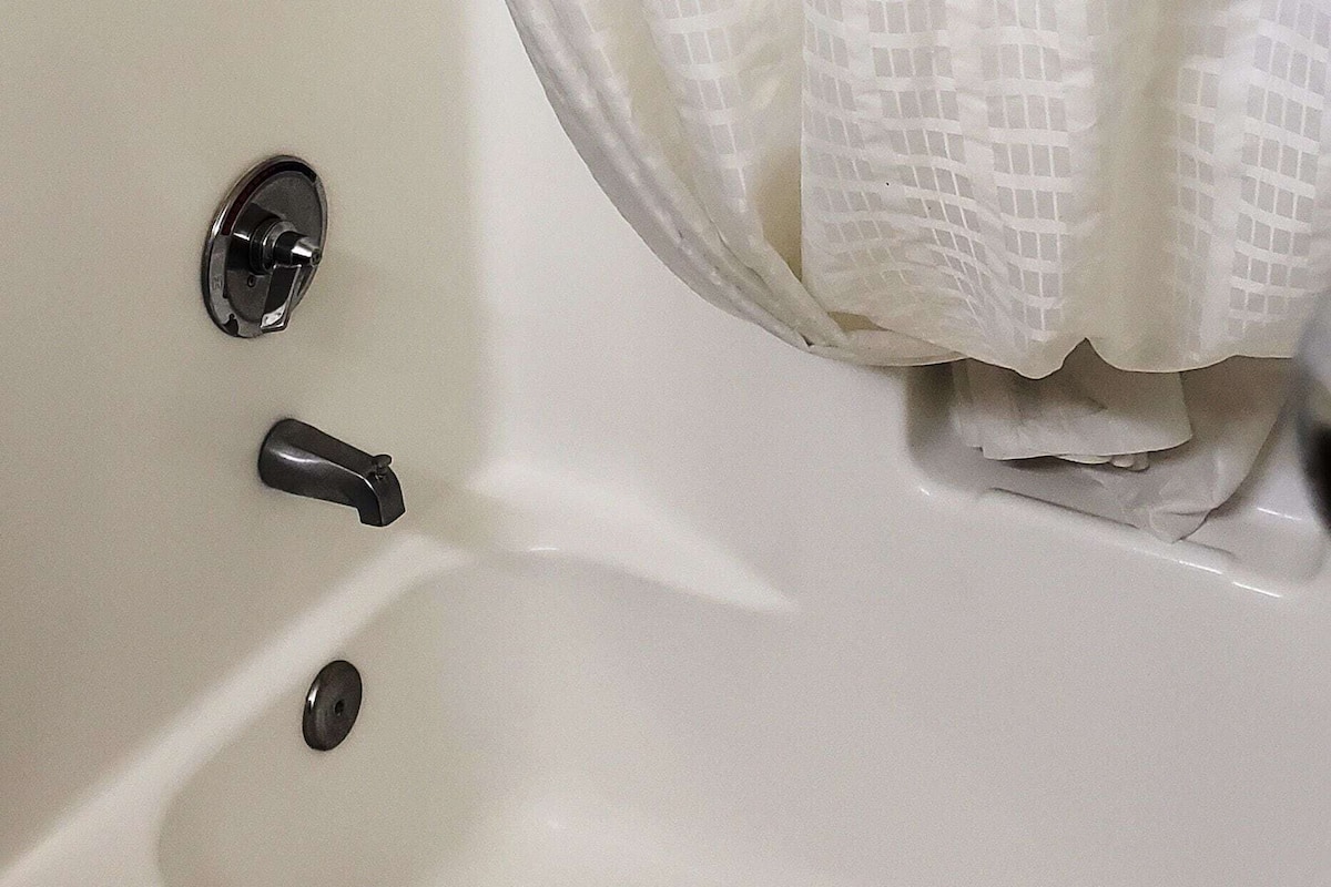 Bathroom | Combined shower/bathtub, deep-soaking bathtub, hair dryer, towels