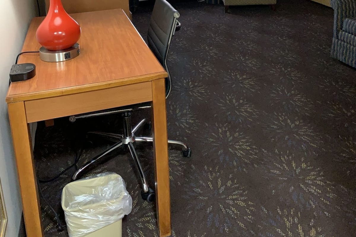 Desk, laptop workspace, blackout curtains, iron/ironing board