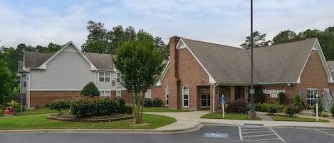 A brick building with a sign reading "Residence Inn."