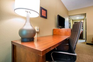 Desk, laptop workspace, blackout drapes, iron/ironing board