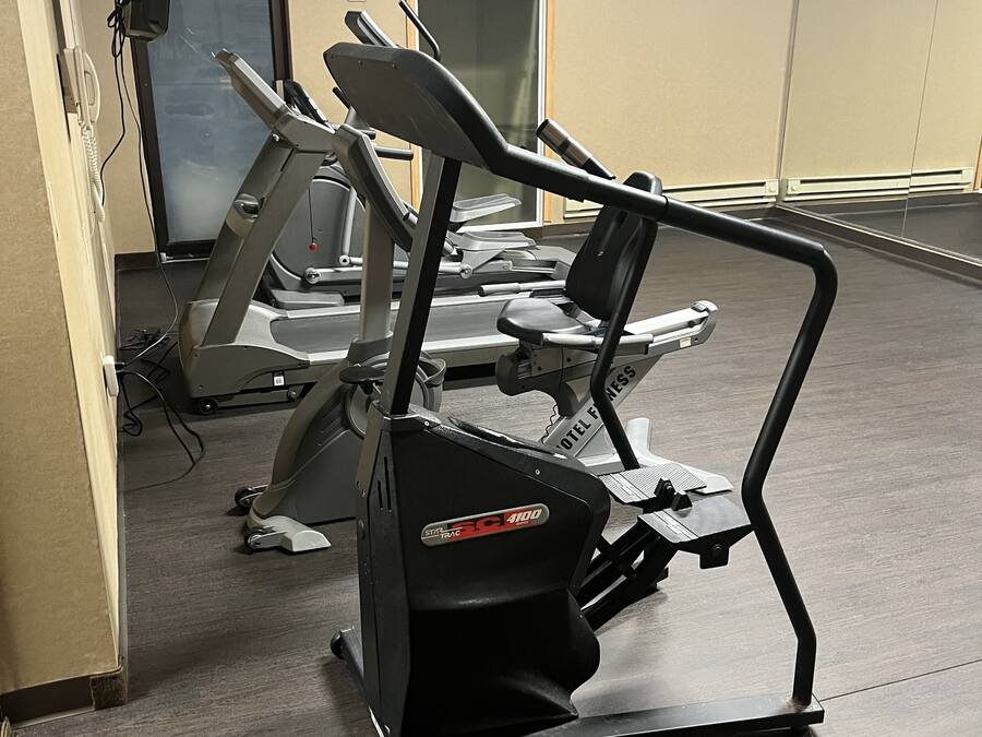 A gym with stationary bikes and treadmills.