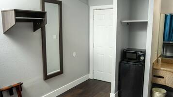 Desk, laptop workspace, blackout drapes, iron/ironing board