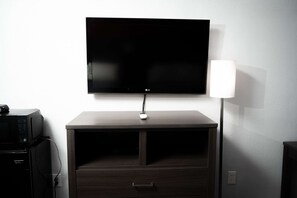 Desk, laptop workspace, blackout curtains, iron/ironing board