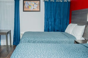 Desk, laptop workspace, blackout drapes, iron/ironing board