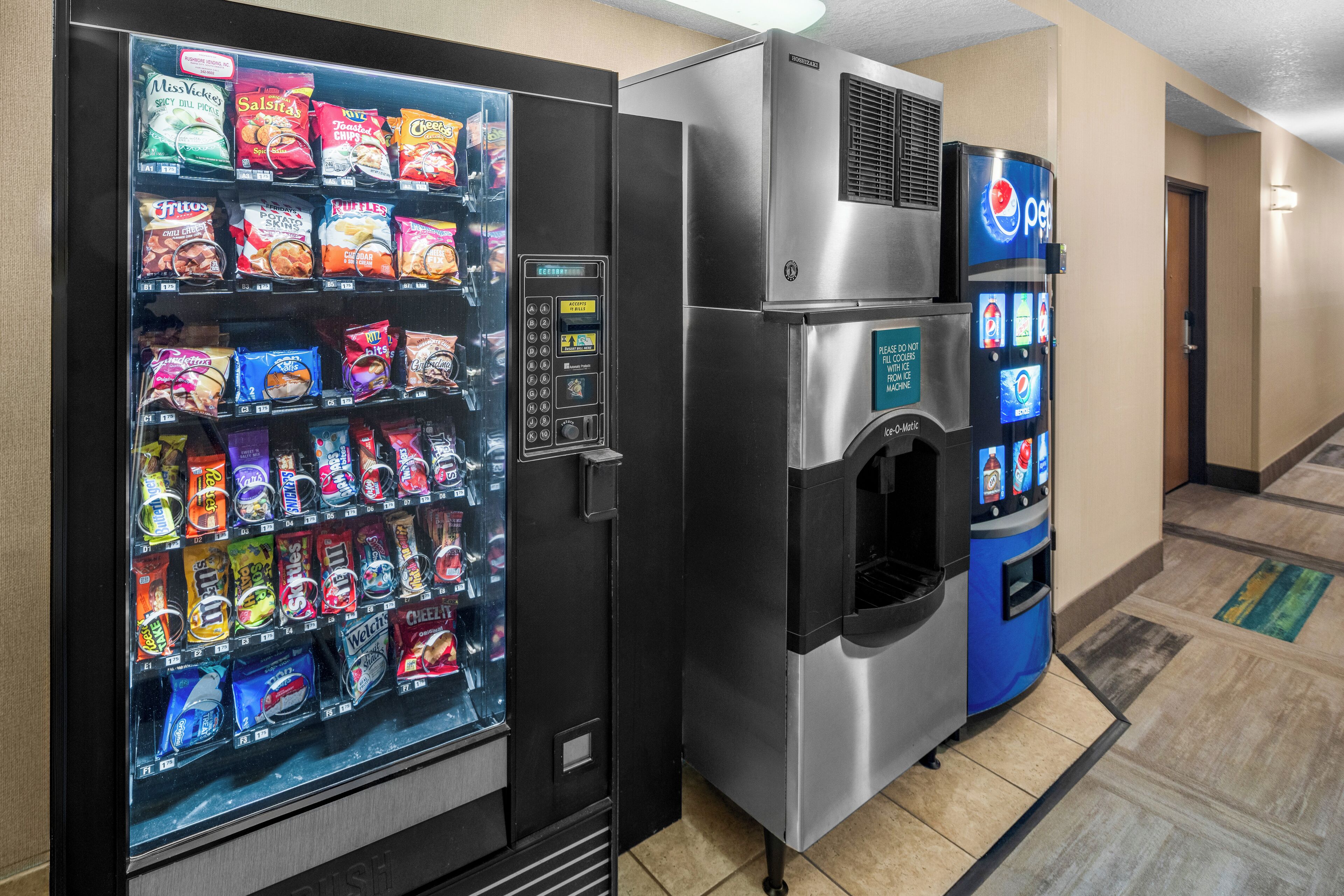 A vending machine with snacks and a water dispenser.