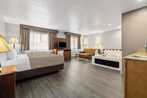 Suite, 1 King Bed, Non Smoking, Hot Tub | In-room safe, iron/ironing board, free cots/infant beds, rollaway beds
