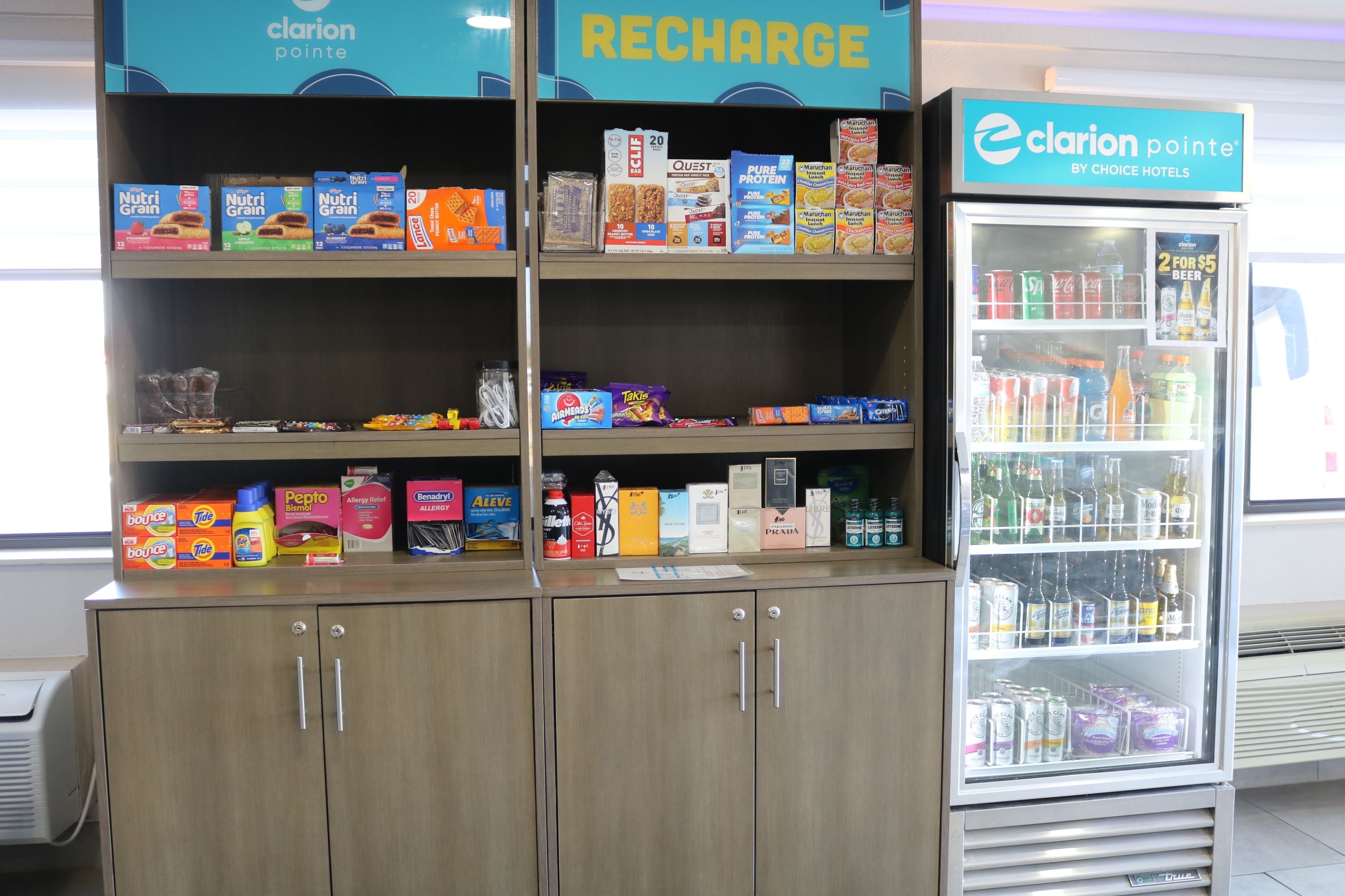 A minibar with snacks, beverages, and a refrigerator.
