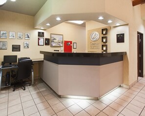 Welcome to Comfort Suites, where guests can check in and access the computer station for assistance.