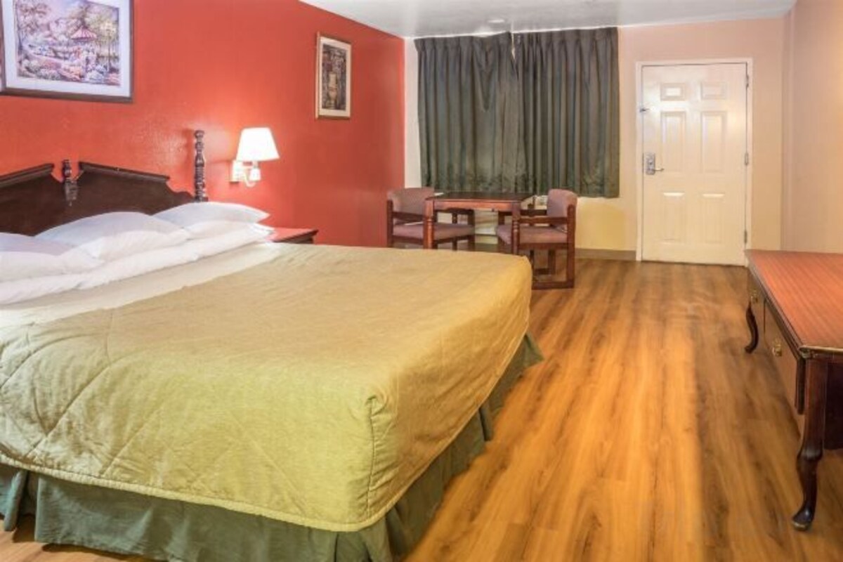 Desk, blackout drapes, bed sheets