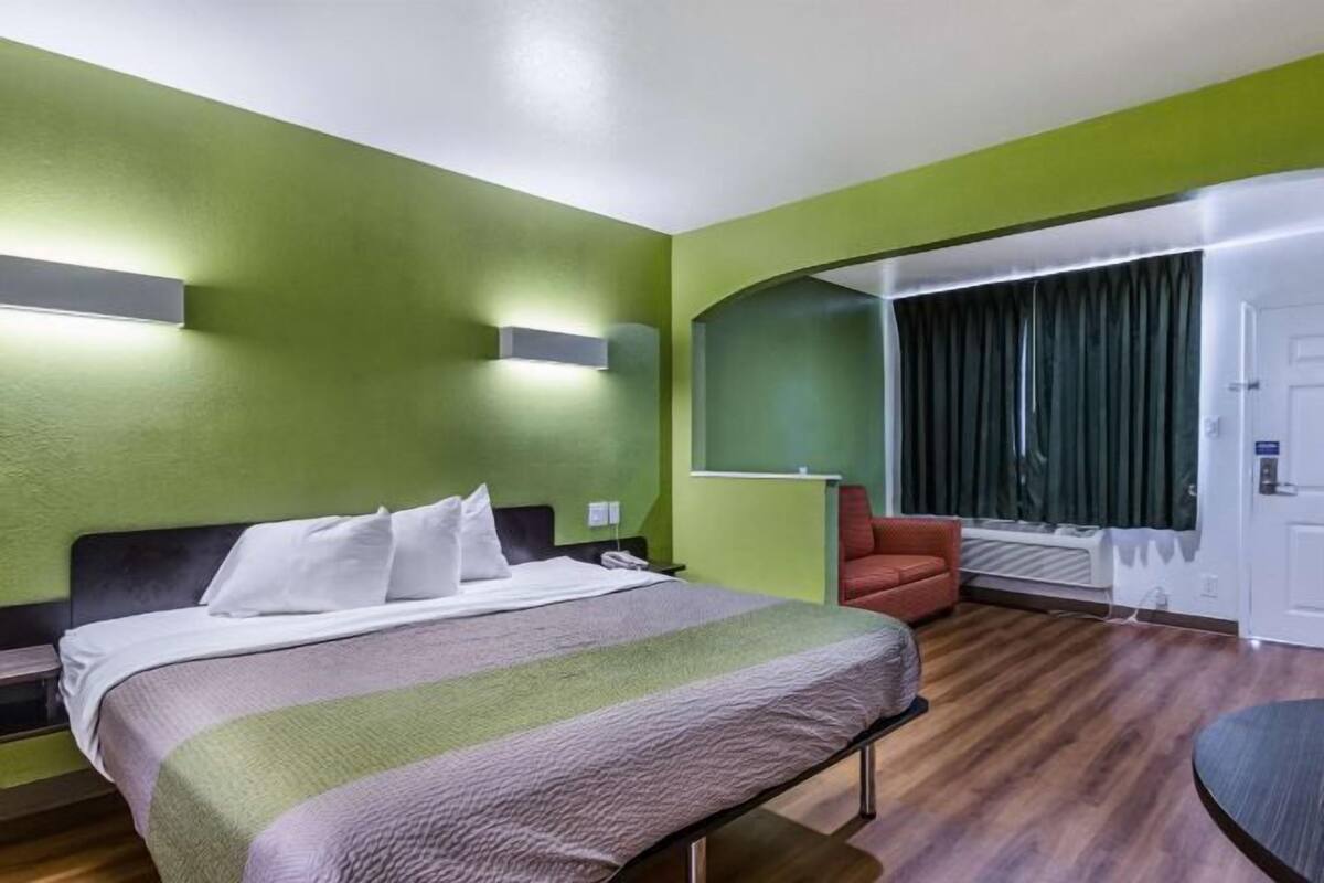 Desk, blackout drapes, bed sheets
