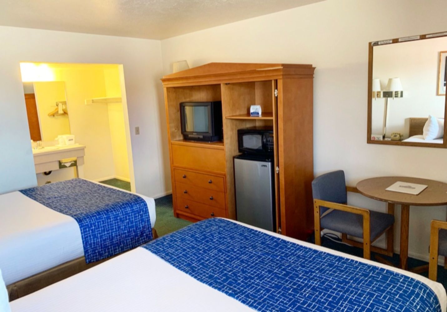 Standard Room, 2 Queen Beds | Living area | 43-inch TV with cable channels