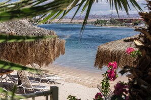 Private beach, beach cabanas, beach towels, beach bar