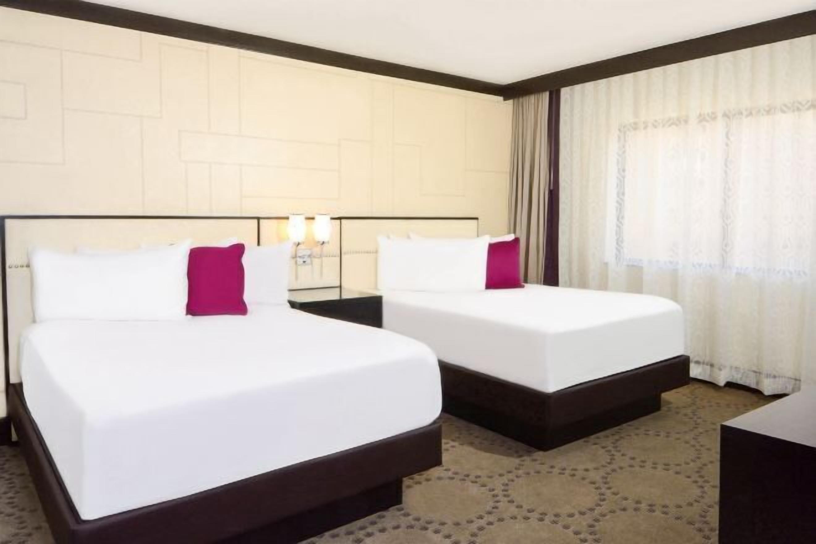 Hypo-allergenic bedding, pillowtop beds, desk, laptop workspace