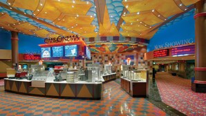 A cinema with a checkered floor and a colorful ceiling.