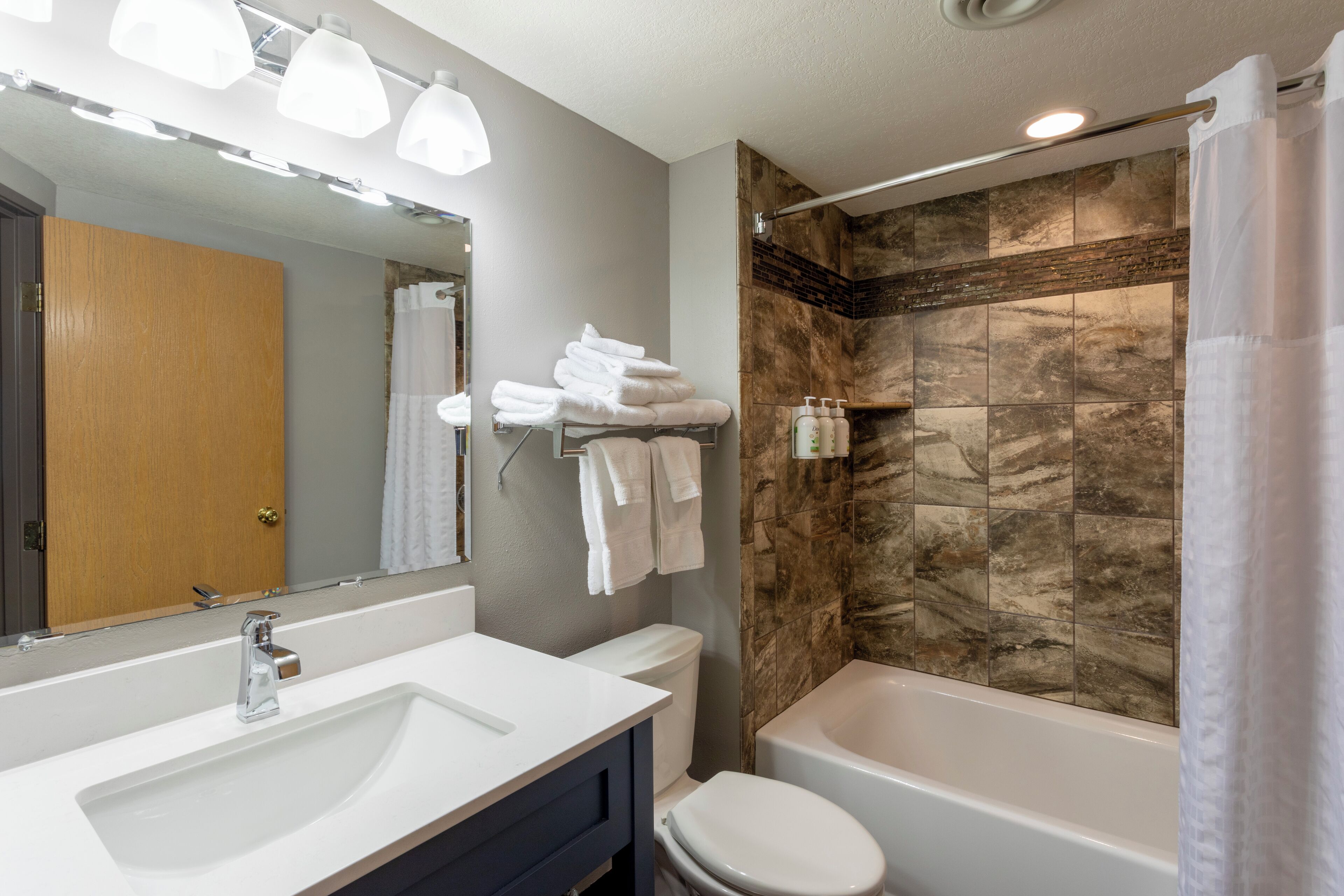 suite, 1 king 1 bed whirlpool fireplace | bathroom | free toiletries, hair dryer, towels, soap