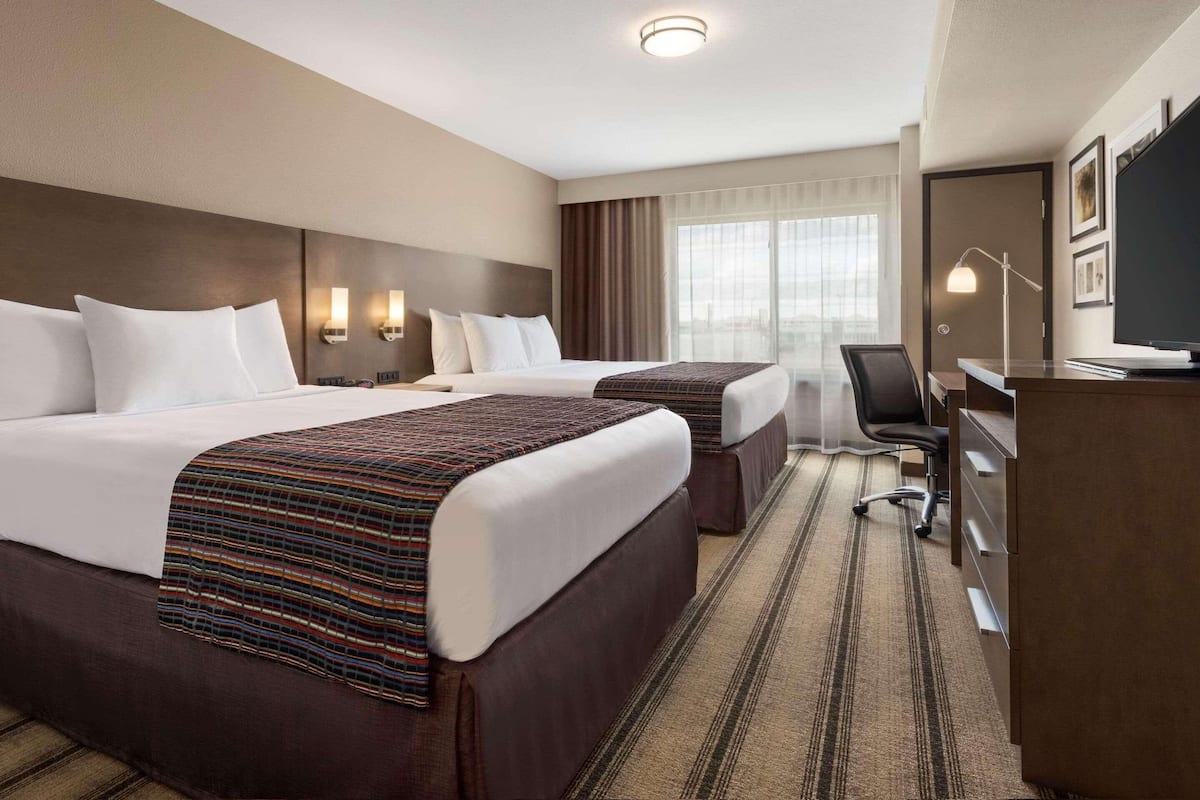 Suite, 1 Bedroom, Non Smoking | 1 bedroom, hypo-allergenic bedding, down comforters, desk