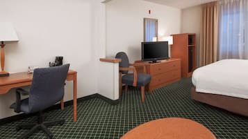 Desk, laptop workspace, blackout drapes, iron/ironing board