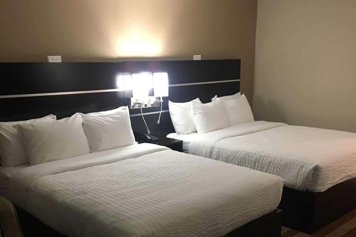 Chambre Deluxe, 2 lits une place | Bureau, fer et planche à repasser, Wi-Fi gratuit